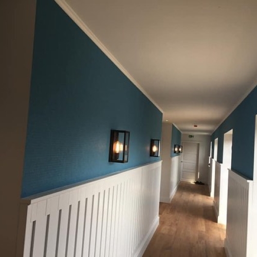 Opsætning af tapet på hotel i Nørresundby